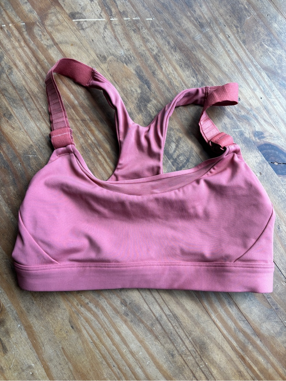 Pink Athleta bra with cool adjustable straps in the front